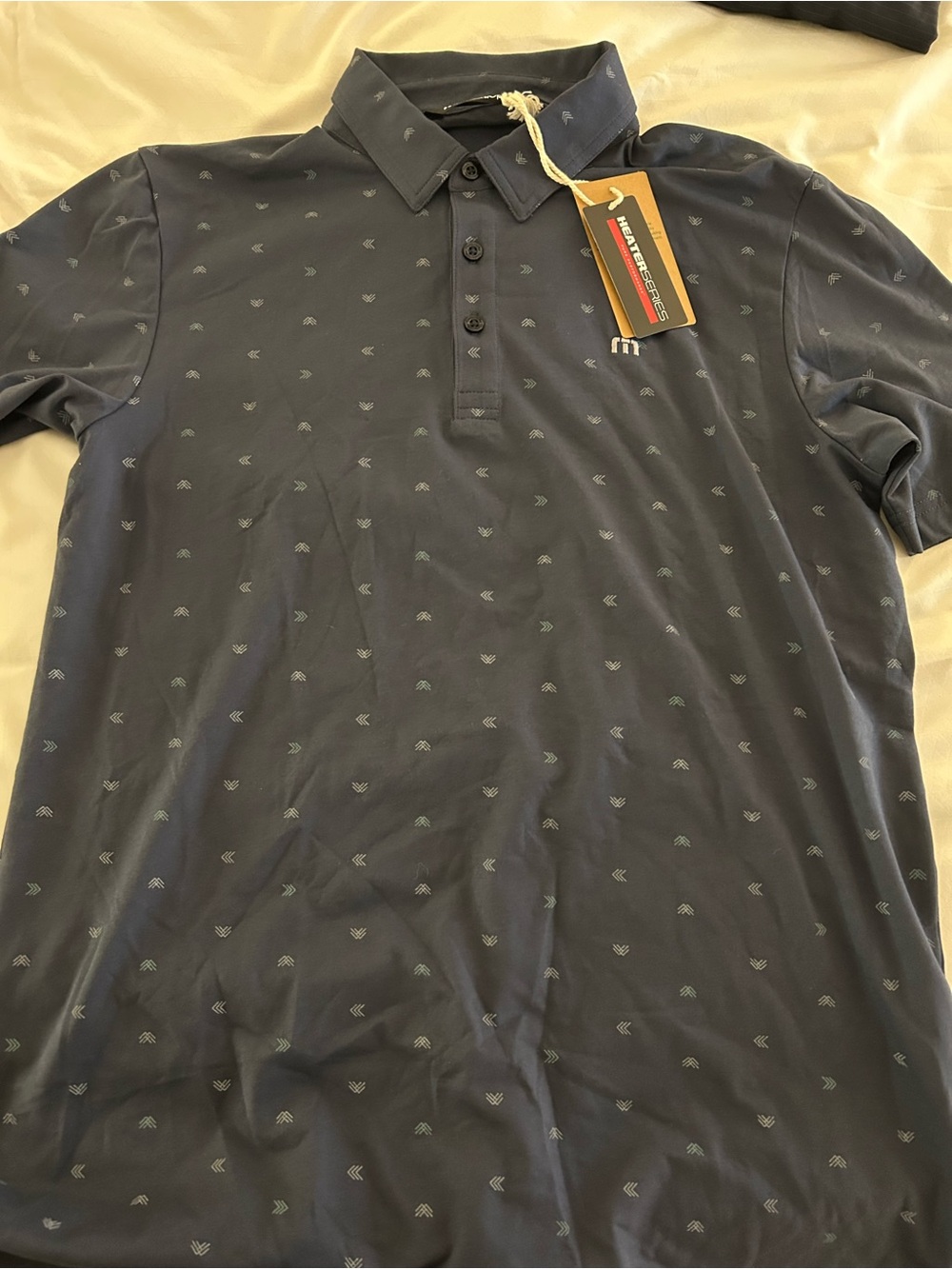 Travis Mathew Navy Polo with Small Anchor Motif